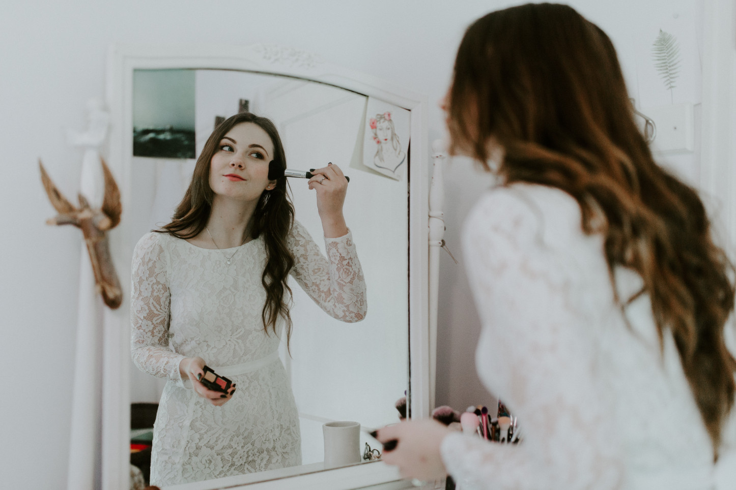 Nicole finishes up her make up at Cannon Beach. Elopement wedding photography at Cannon Beach by Sienna Plus Josh.