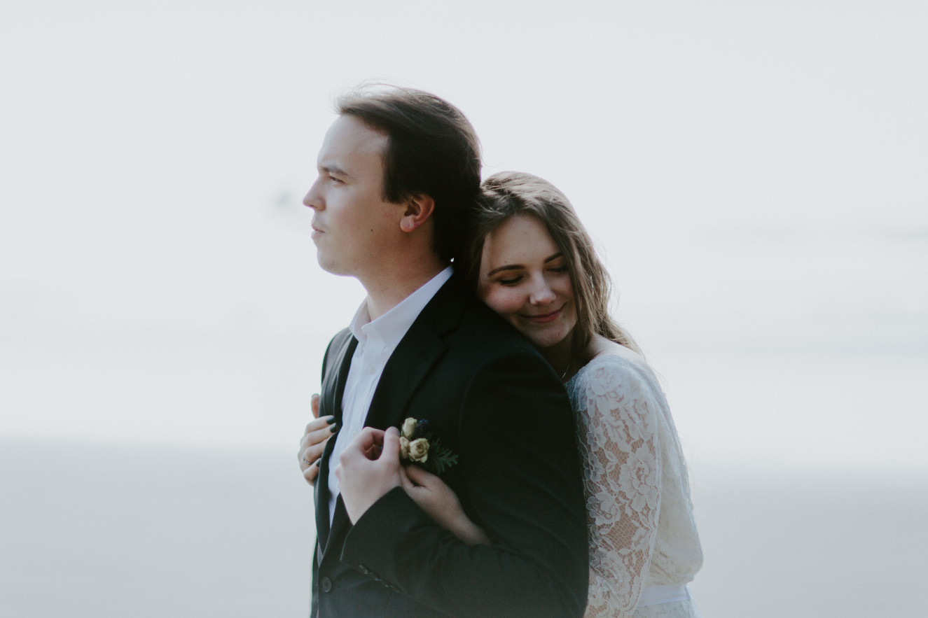 Nicole and Vlad stand on Indian Beach. Elopement wedding photography at Cannon Beach by Sienna Plus Josh.