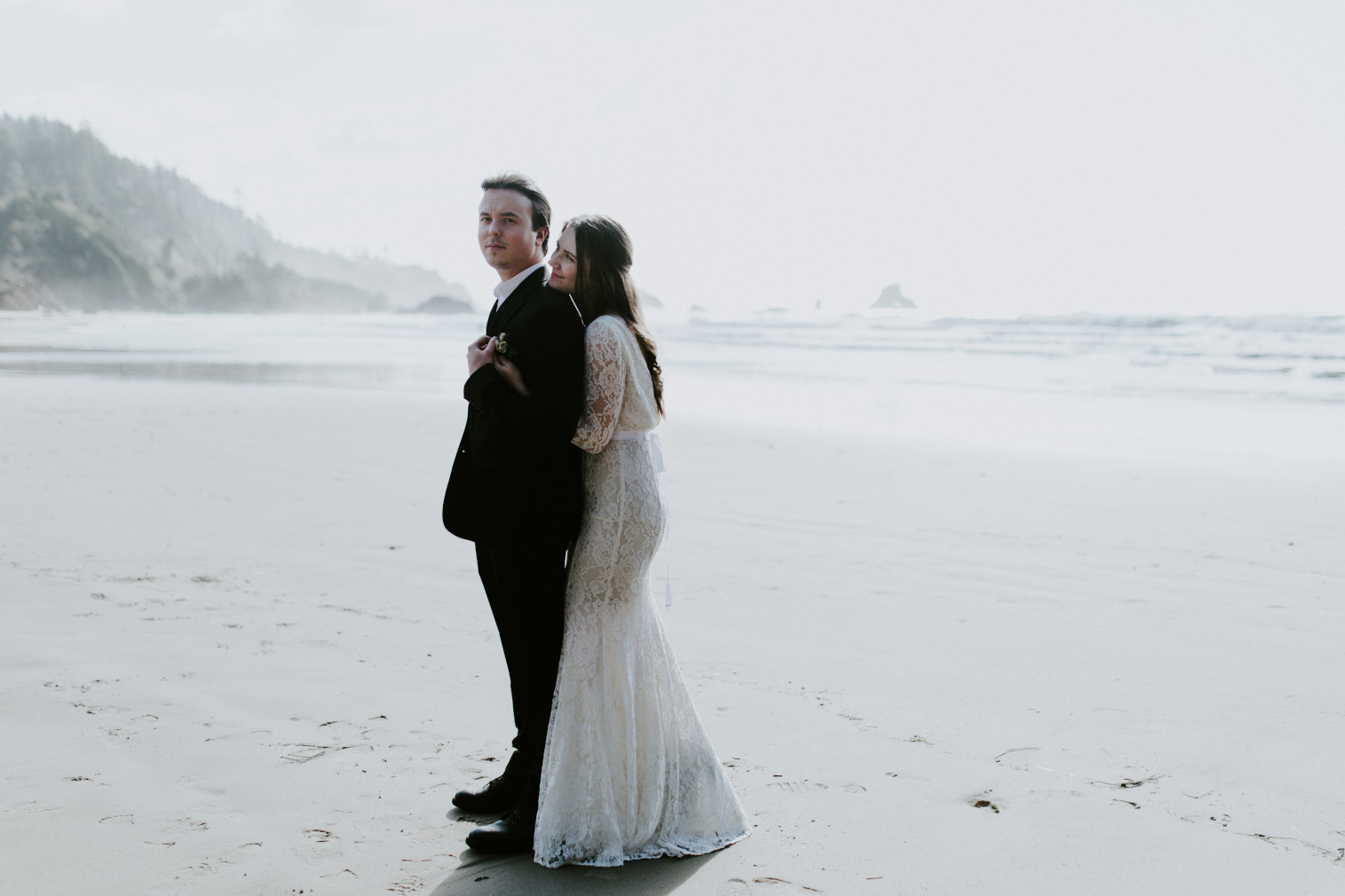 Nicole stands with her mom. Elopement wedding photography at Cannon Beach by Sienna Plus Josh.