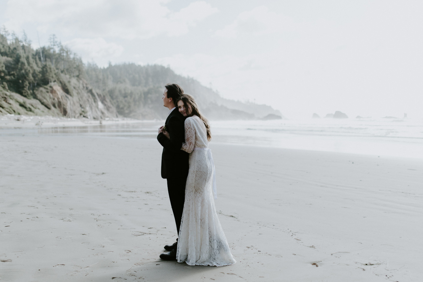 Nicole hugs Vlad at Indian Beach. Elopement wedding photography at Cannon Beach by Sienna Plus Josh.