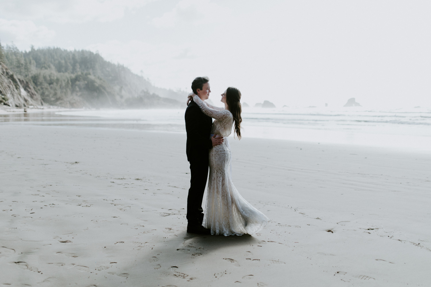 Nicole and Vlad hug on Indian Beach. Elopement wedding photography at Cannon Beach by Sienna Plus Josh.
