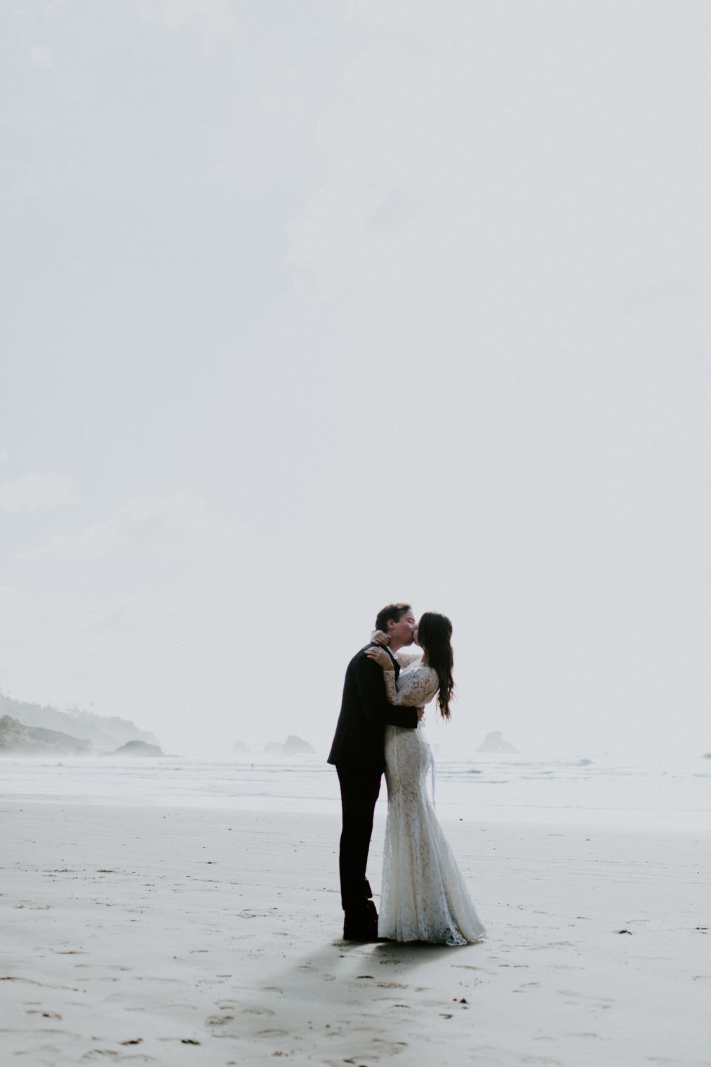 Nicole and Vlad dance on the beach after their elopement. Elopement wedding photography at Cannon Beach by Sienna Plus Josh.