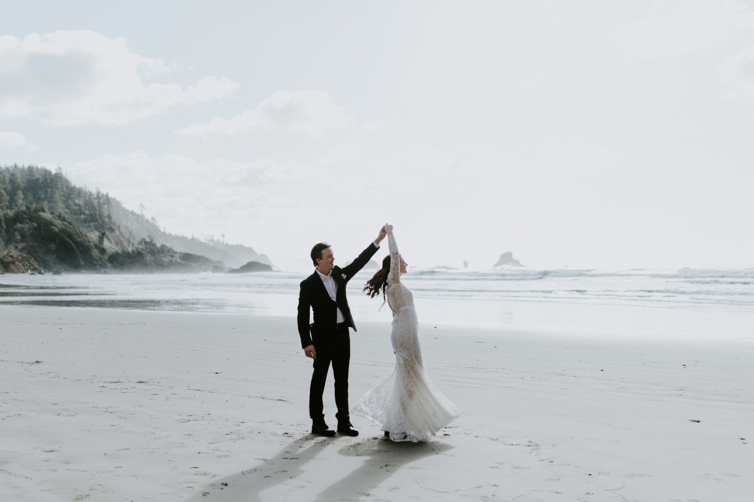 Nicole and Vlad dance on the beach. Elopement wedding photography at Cannon Beach by Sienna Plus Josh.