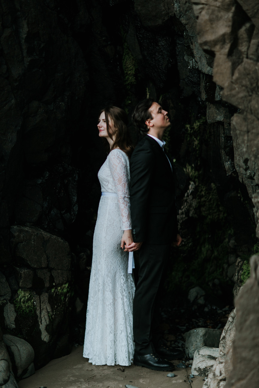 Nicole and Vlad stand near the rocks of Indian Beach. Elopement wedding photography at Cannon Beach by Sienna Plus Josh.