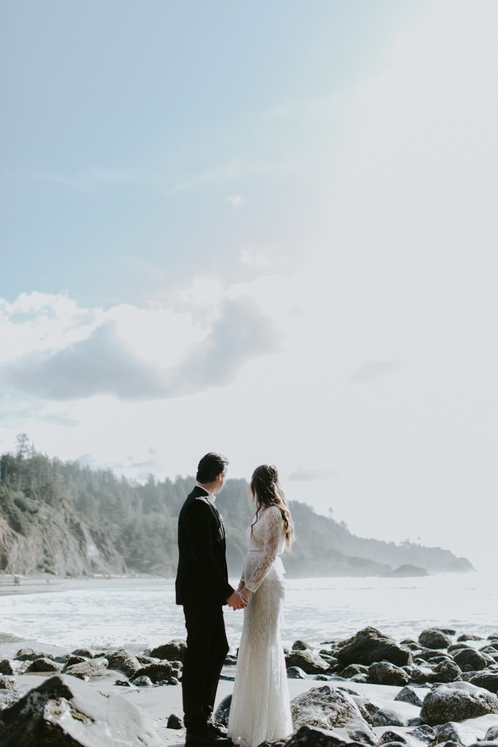 Nicole and Vlad laughing at the beach. Elopement wedding photography at Cannon Beach by Sienna Plus Josh.