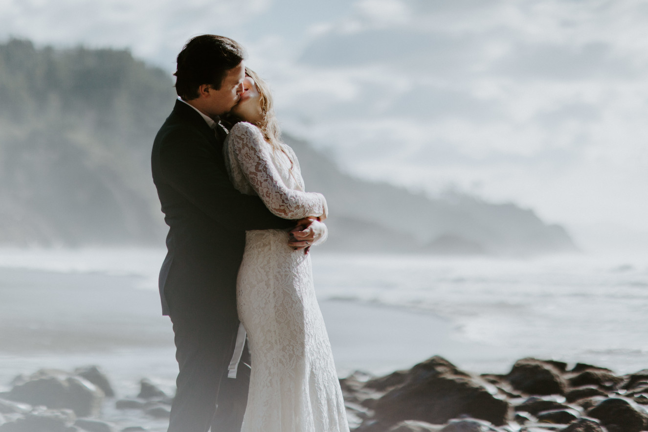 Nicole and Vlad admire the view of the ocean. Elopement wedding photography at Cannon Beach by Sienna Plus Josh.