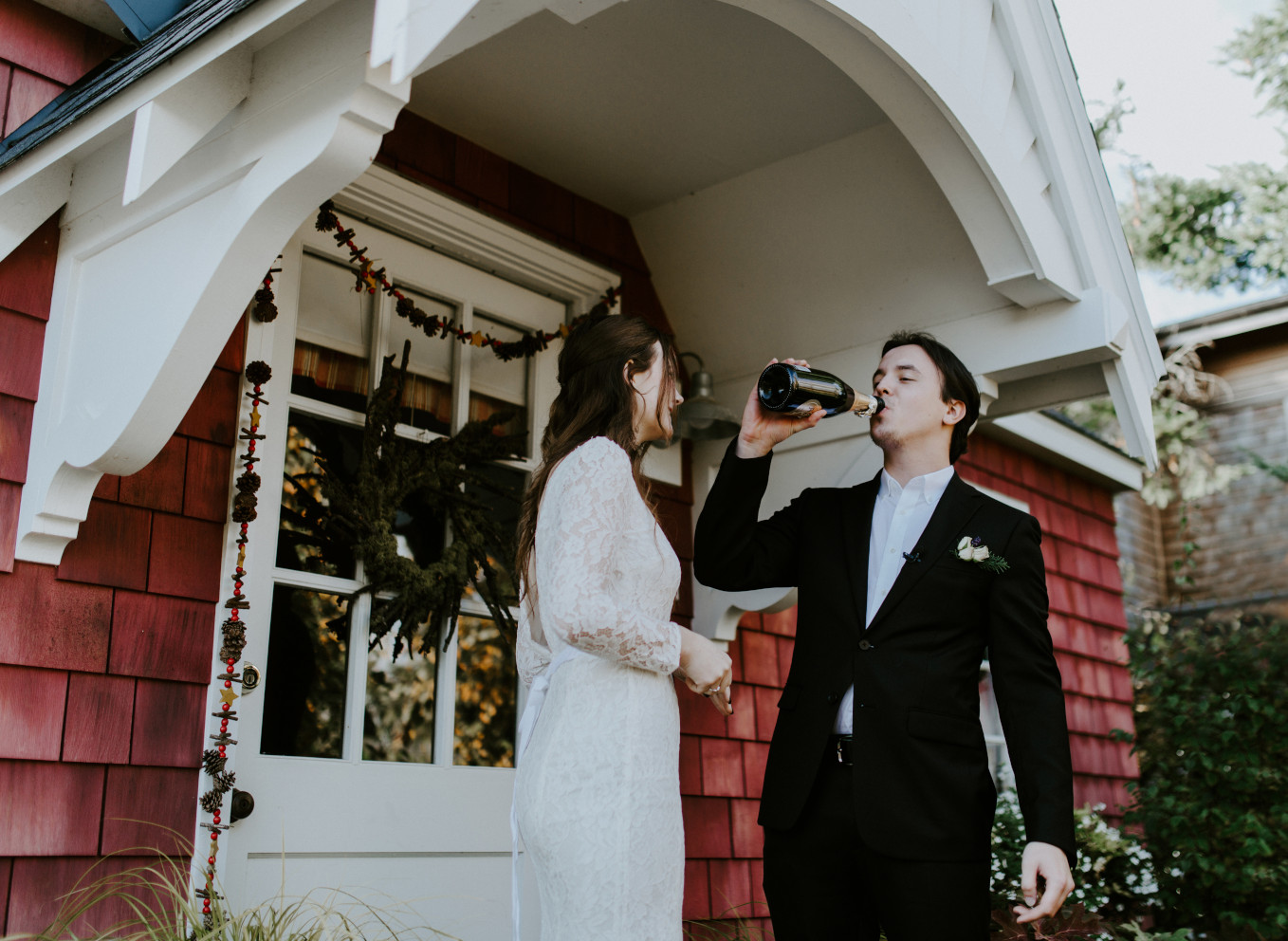 Vlad drinks champagne. Elopement wedding photography at Cannon Beach by Sienna Plus Josh.