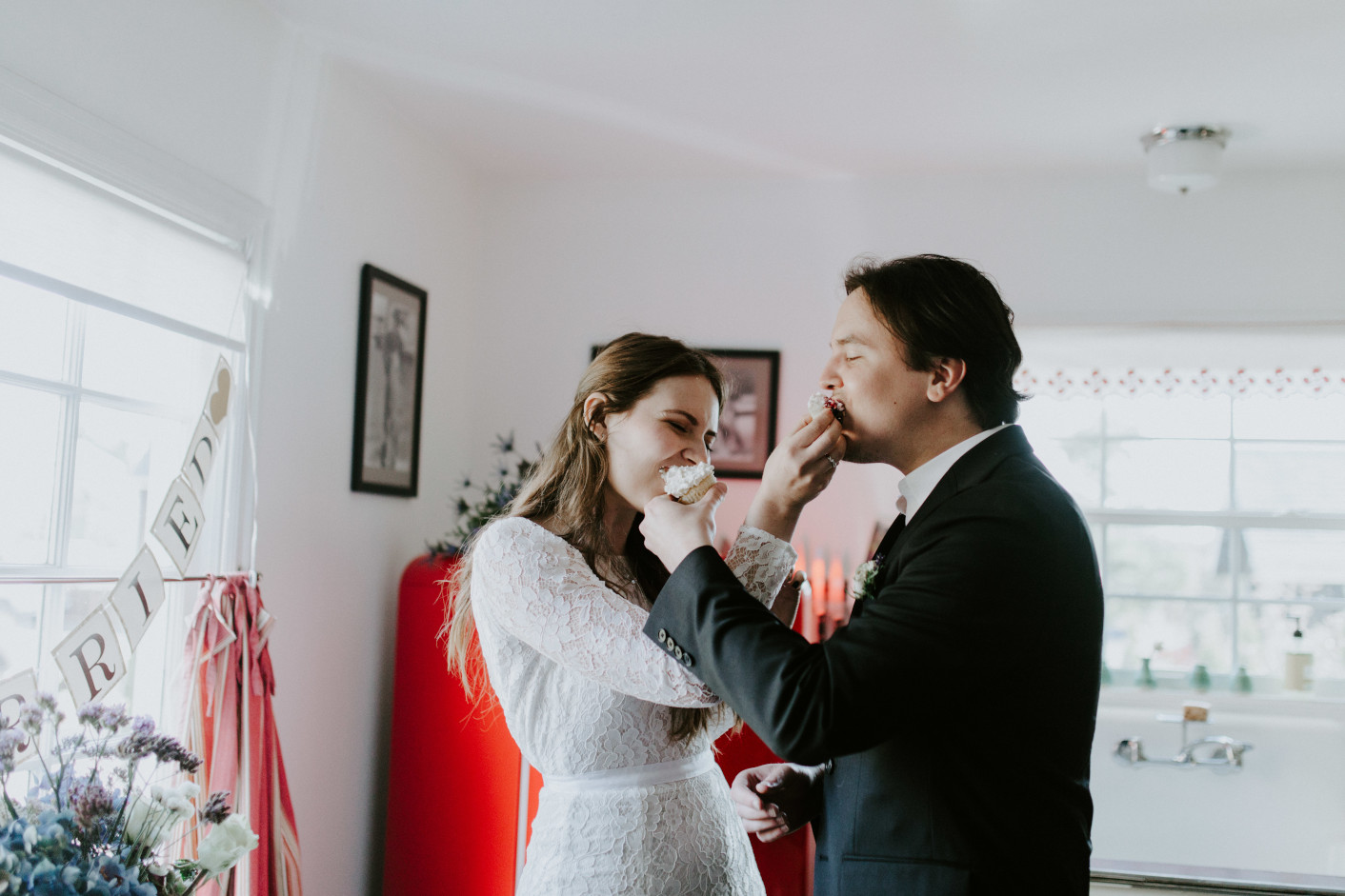 Nicole and Vlad eat cupcakes. Elopement wedding photography at Cannon Beach by Sienna Plus Josh.