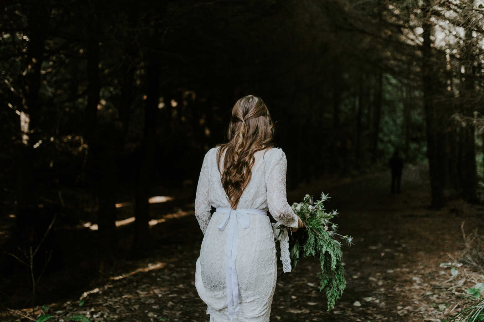 Nicole walks up a trail. Elopement wedding photography at Cannon Beach by Sienna Plus Josh.