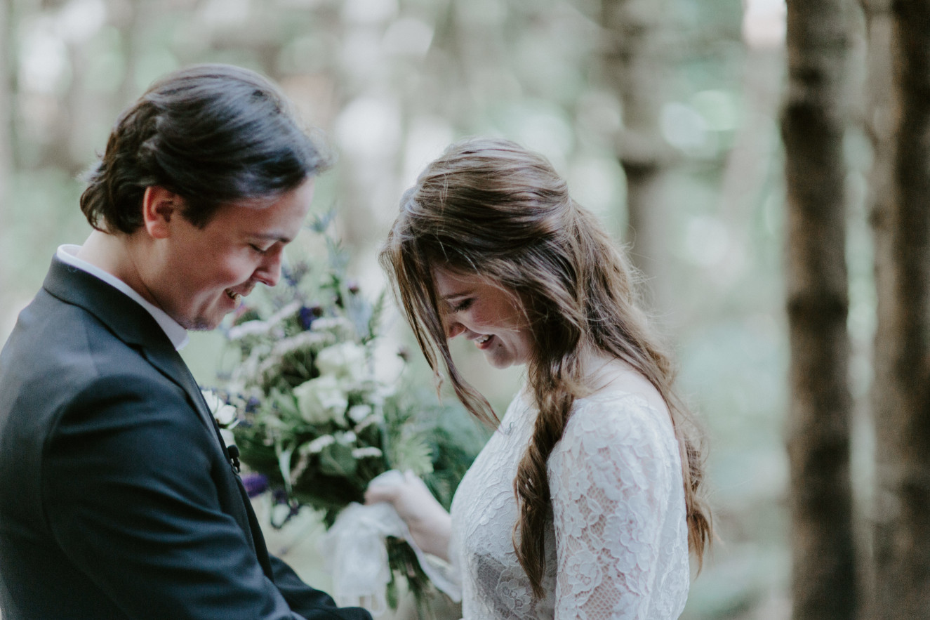 Nicole and Vlad admire each other. Elopement wedding photography at Cannon Beach by Sienna Plus Josh.