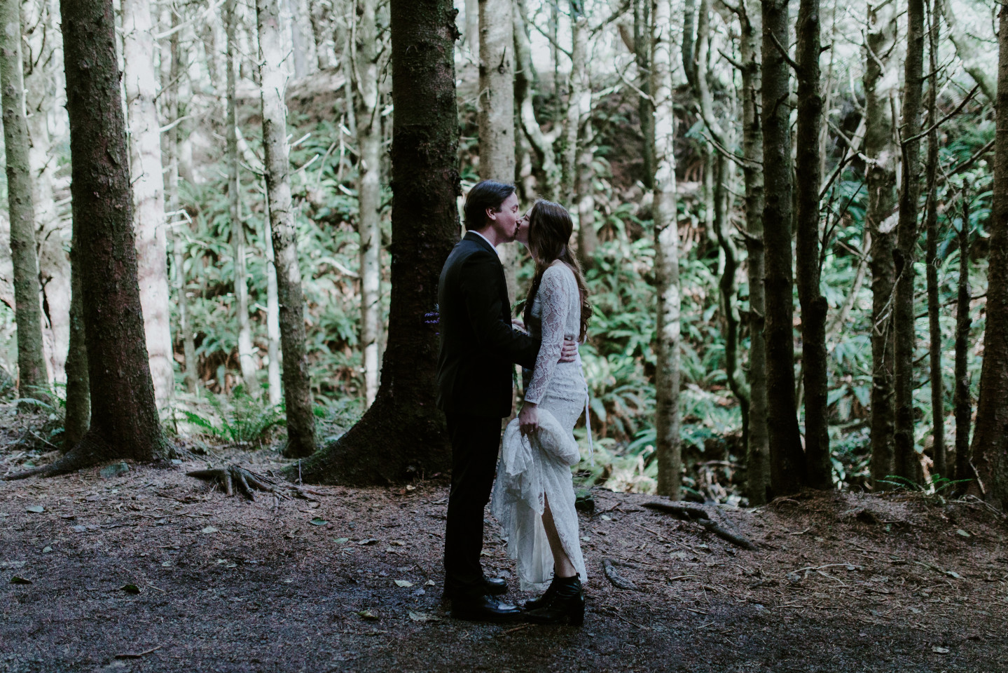 Vlad kisses Nicole. Elopement wedding photography at Cannon Beach by Sienna Plus Josh.
