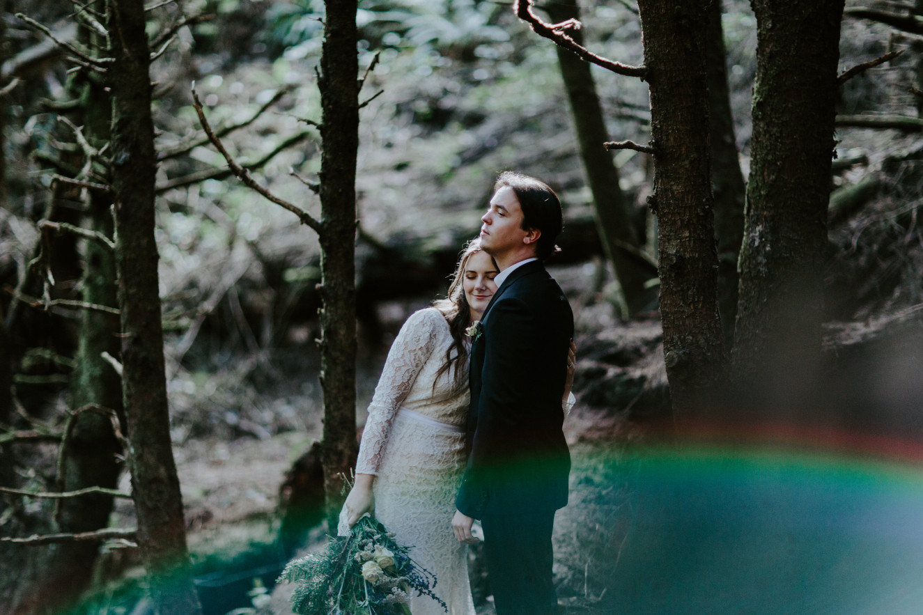 Nicole hugs Vlad. Elopement wedding photography at Cannon Beach by Sienna Plus Josh.