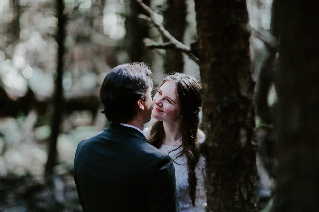 Vlad and Nicole admire each other at Cannon Beach, OR. Elopement wedding photography at Cannon Beach by Sienna Plus Josh.