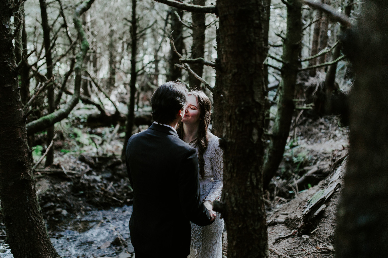 Vlad and Nicole move in for a kiss. Elopement wedding photography at Cannon Beach by Sienna Plus Josh.