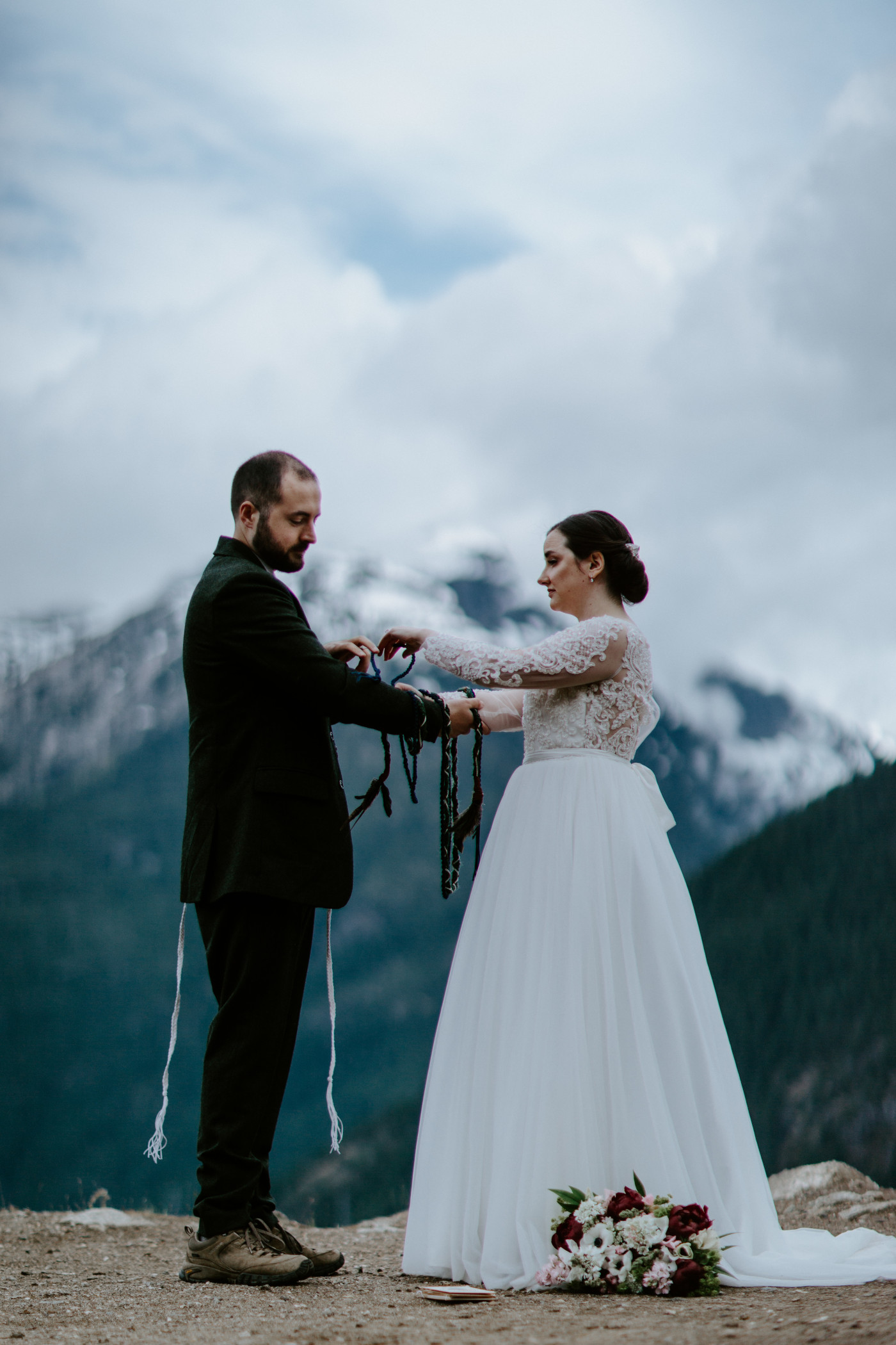 Alex and Elizabeth performing the rope tying ceremony. Elopement photography at North Cascades National Park by Sienna Plus Josh.