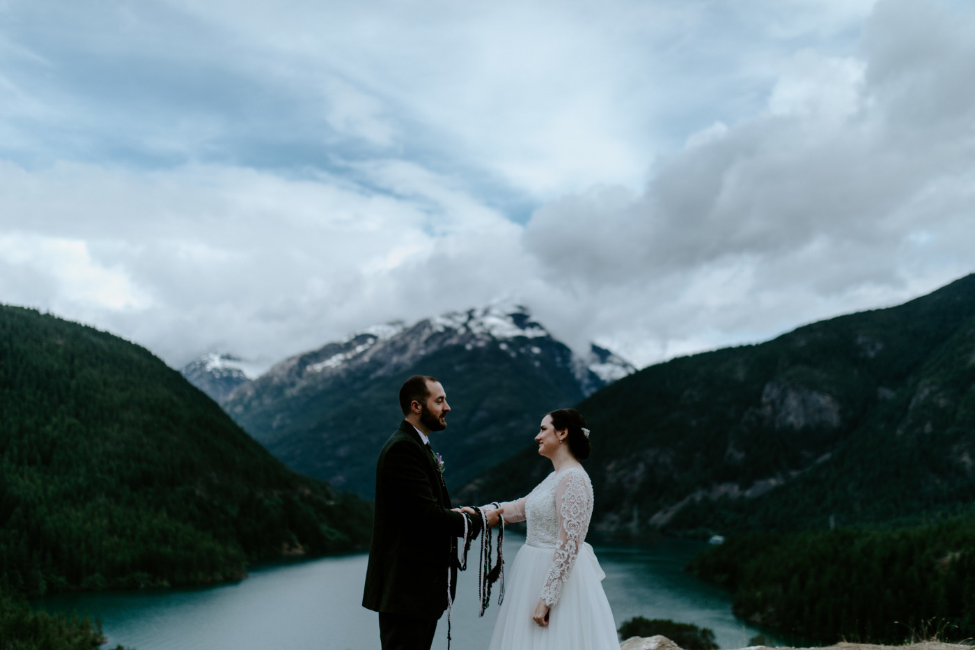 Alex and Elizabeth finalizing their elopement ceremony. Elopement photography at North Cascades National Park by Sienna Plus Josh.