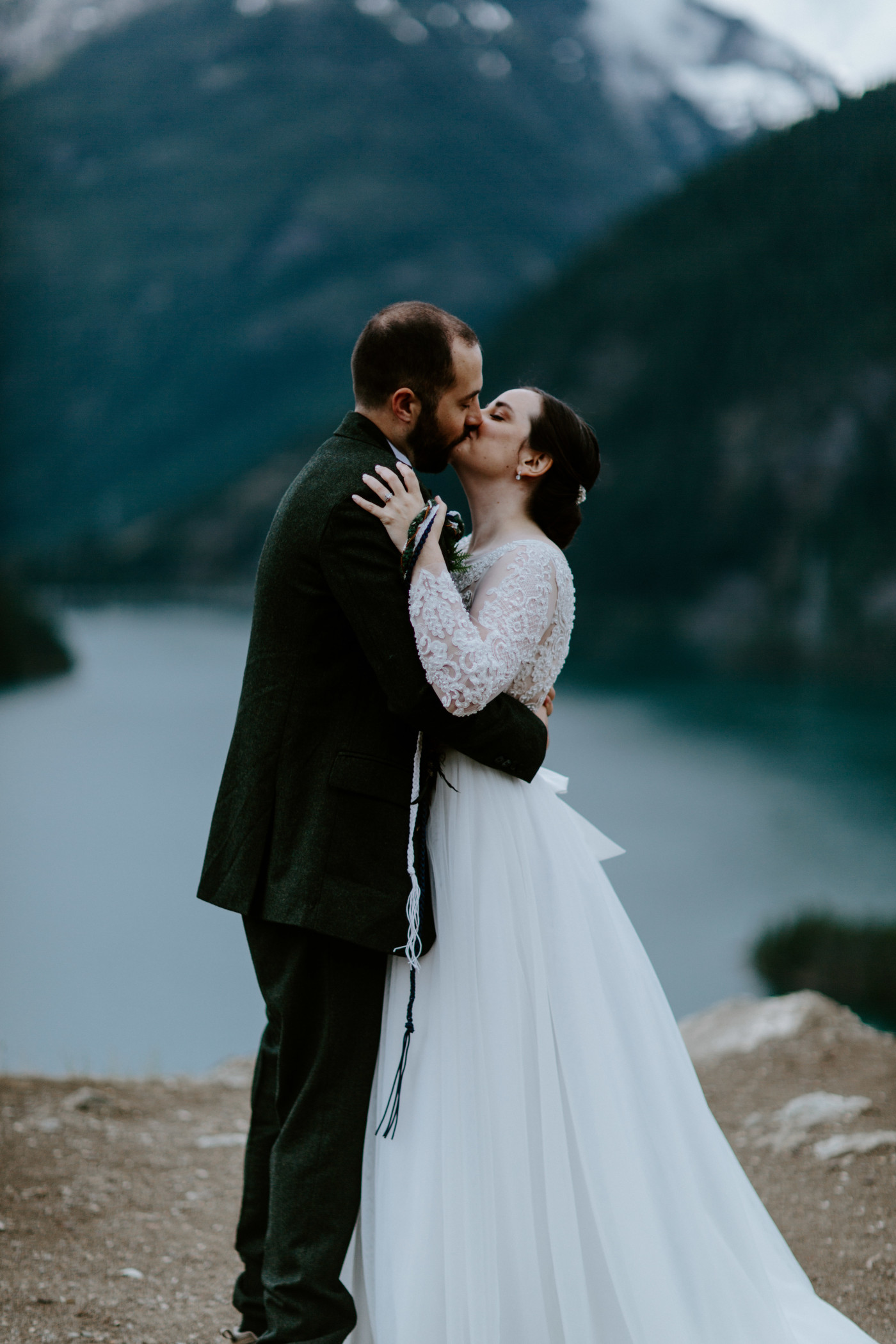 Alex and Elizabeth kiss at Diablo Lake Overlook. Elopement photography at North Cascades National Park by Sienna Plus Josh.