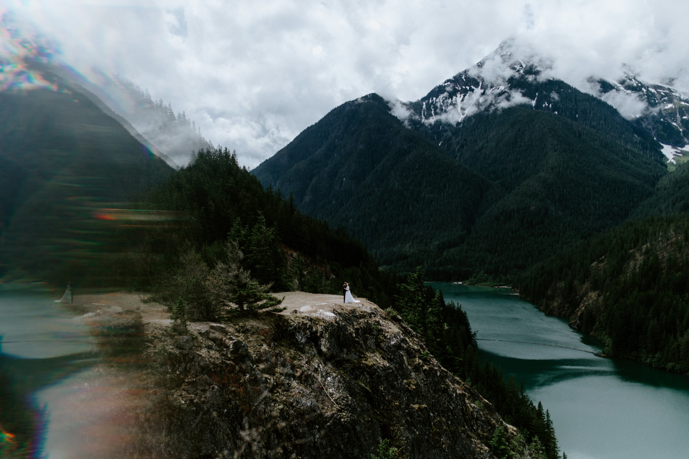 Elizabeth and Alex hug at the cliffside. Elopement photography at North Cascades National Park by Sienna Plus Josh.