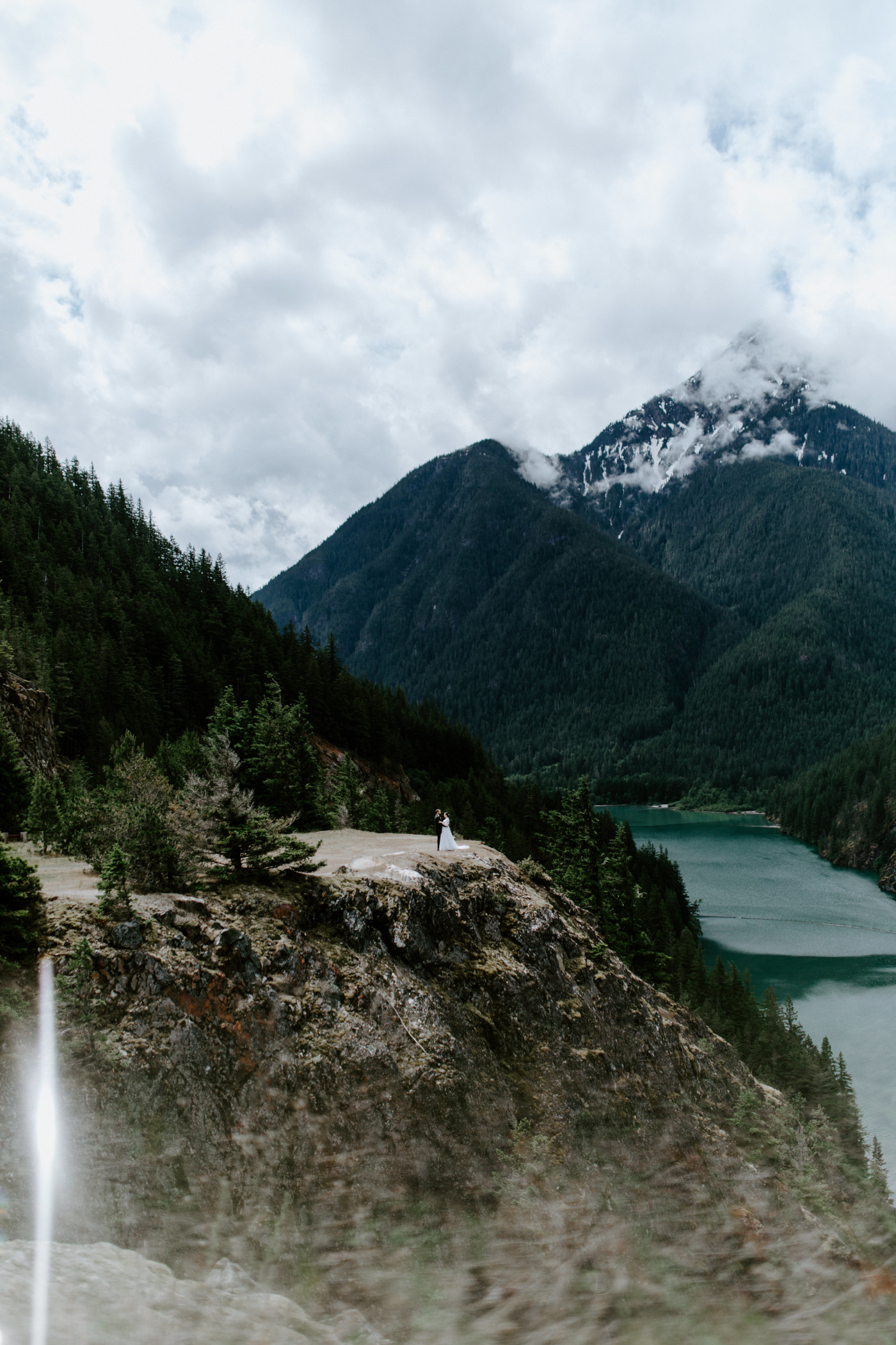 Alex and Elizabeth stand at the edge of Diablo Lake Overlook. Elopement photography at North Cascades National Park by Sienna Plus Josh.