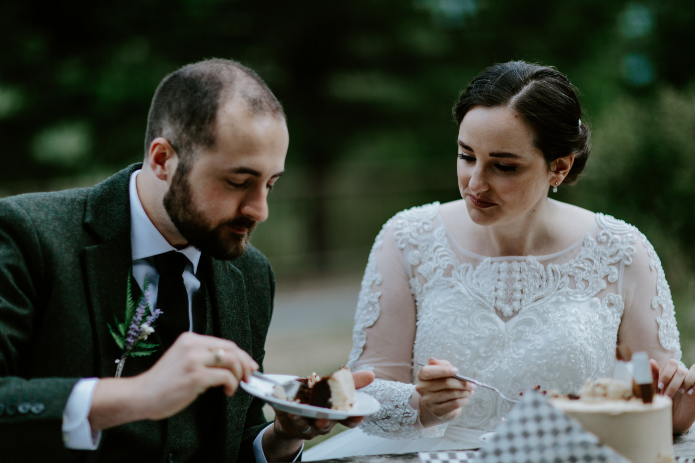Elizabeth and Alex feed each other cake. Elopement photography at North Cascades National Park by Sienna Plus Josh.