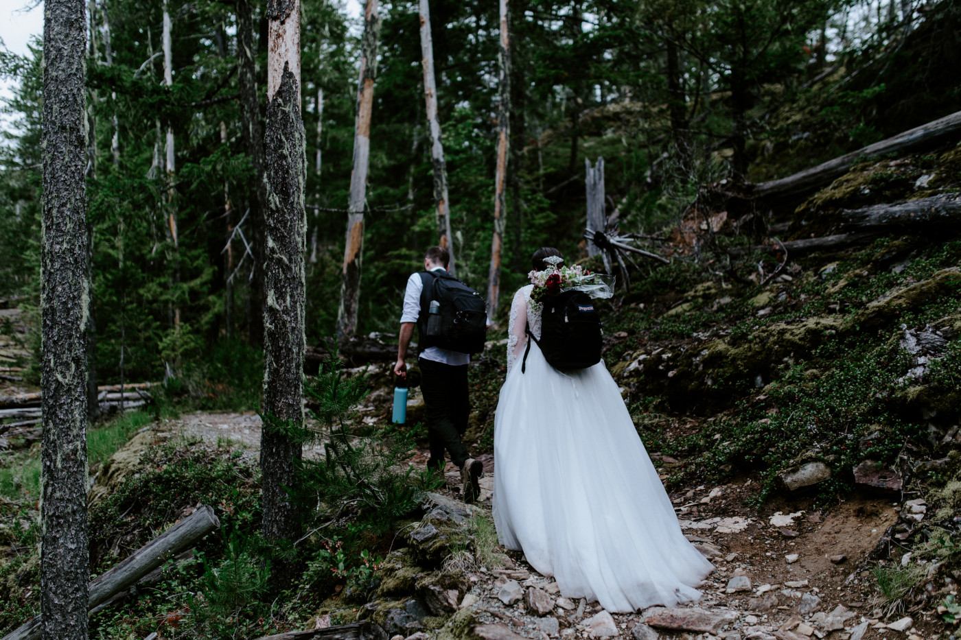 Alex and Elizabeth eat their cake. Elopement photography at North Cascades National Park by Sienna Plus Josh.