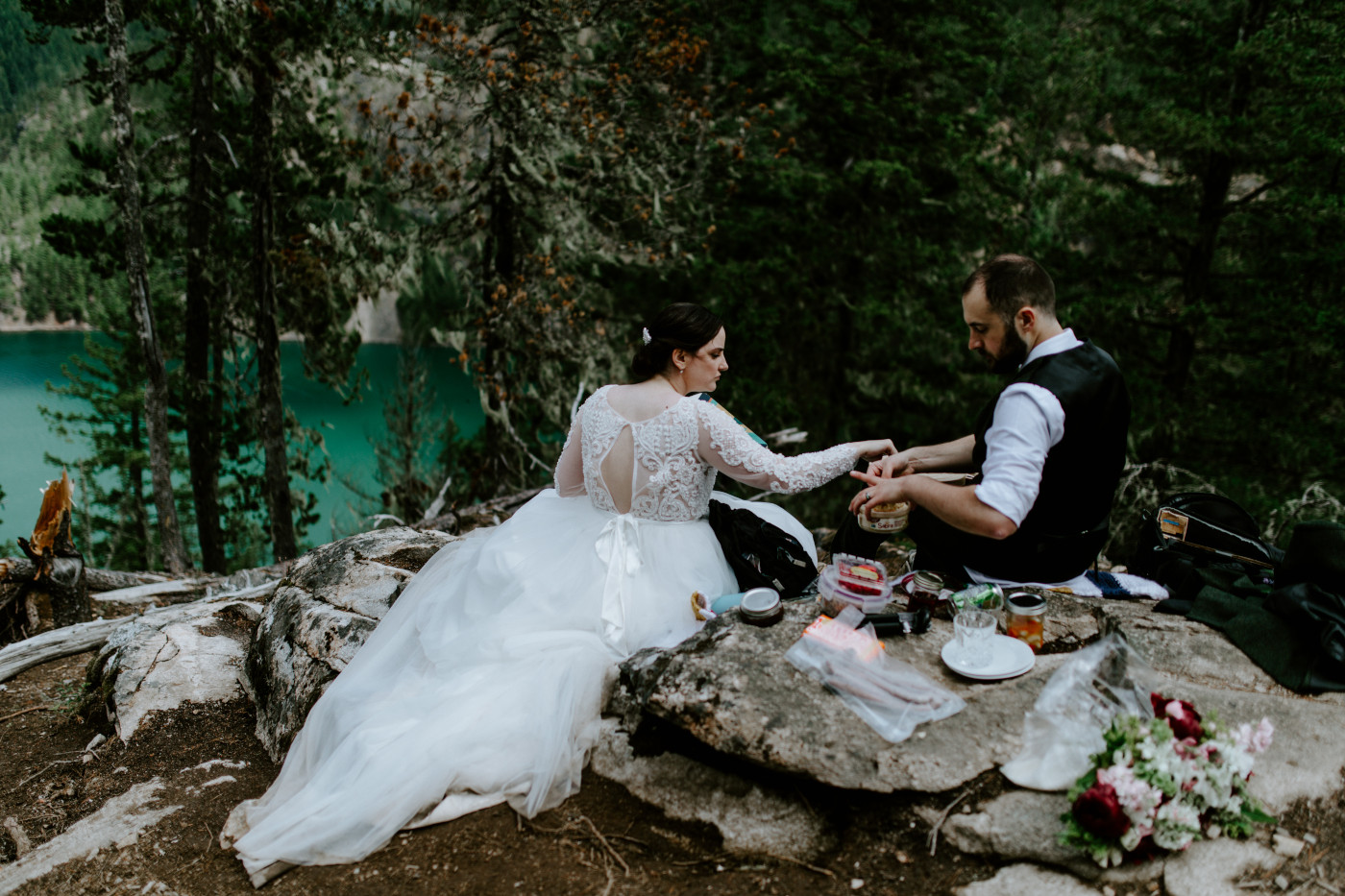 Elizabeth and Alex prepare their picnic in the North Cascades. Elopement photography at North Cascades National Park by Sienna Plus Josh.