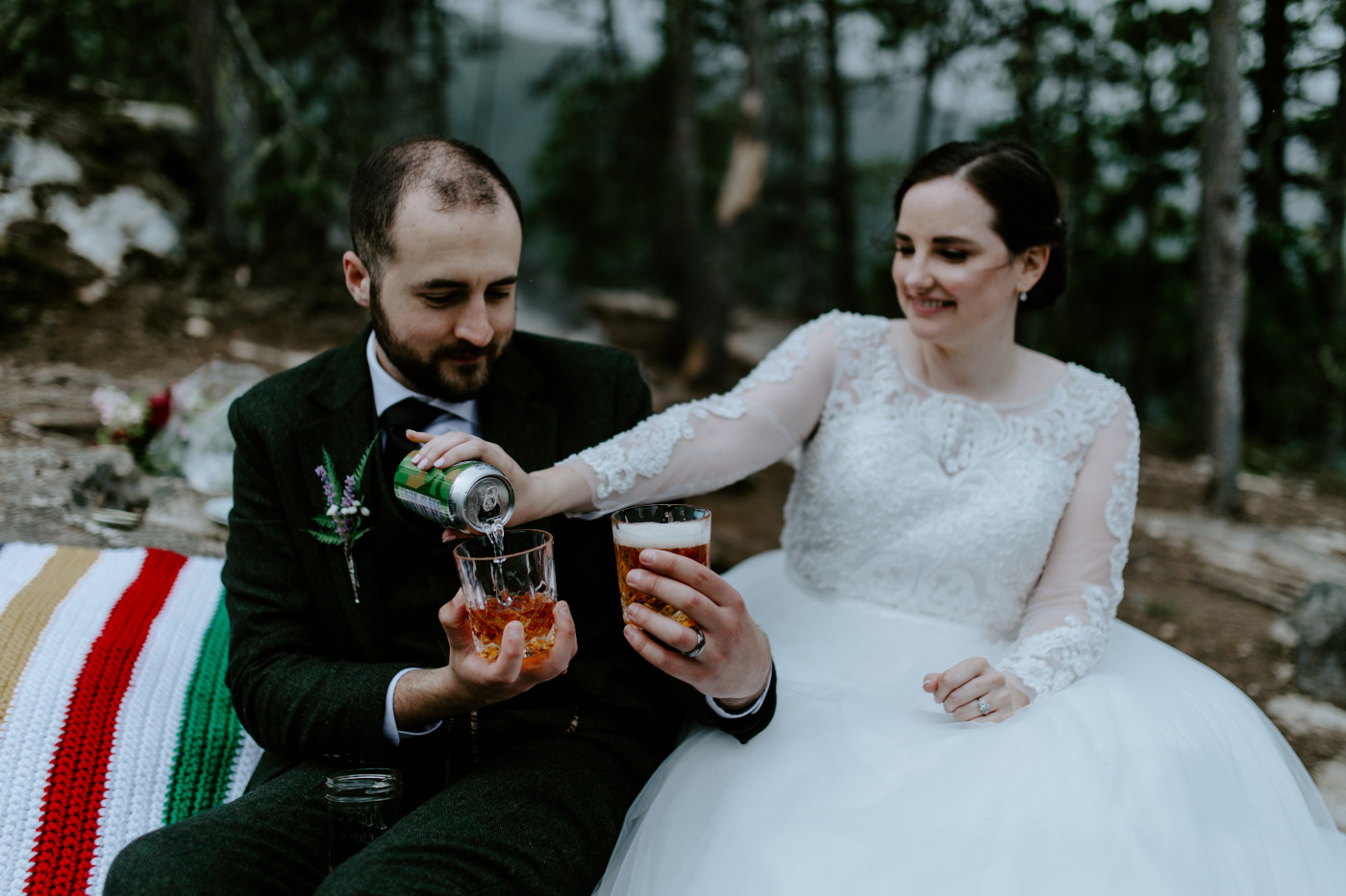 Elizabeth and Alex pouring drinks to celebrate their elopement. Elopement photography at North Cascades National Park by Sienna Plus Josh.