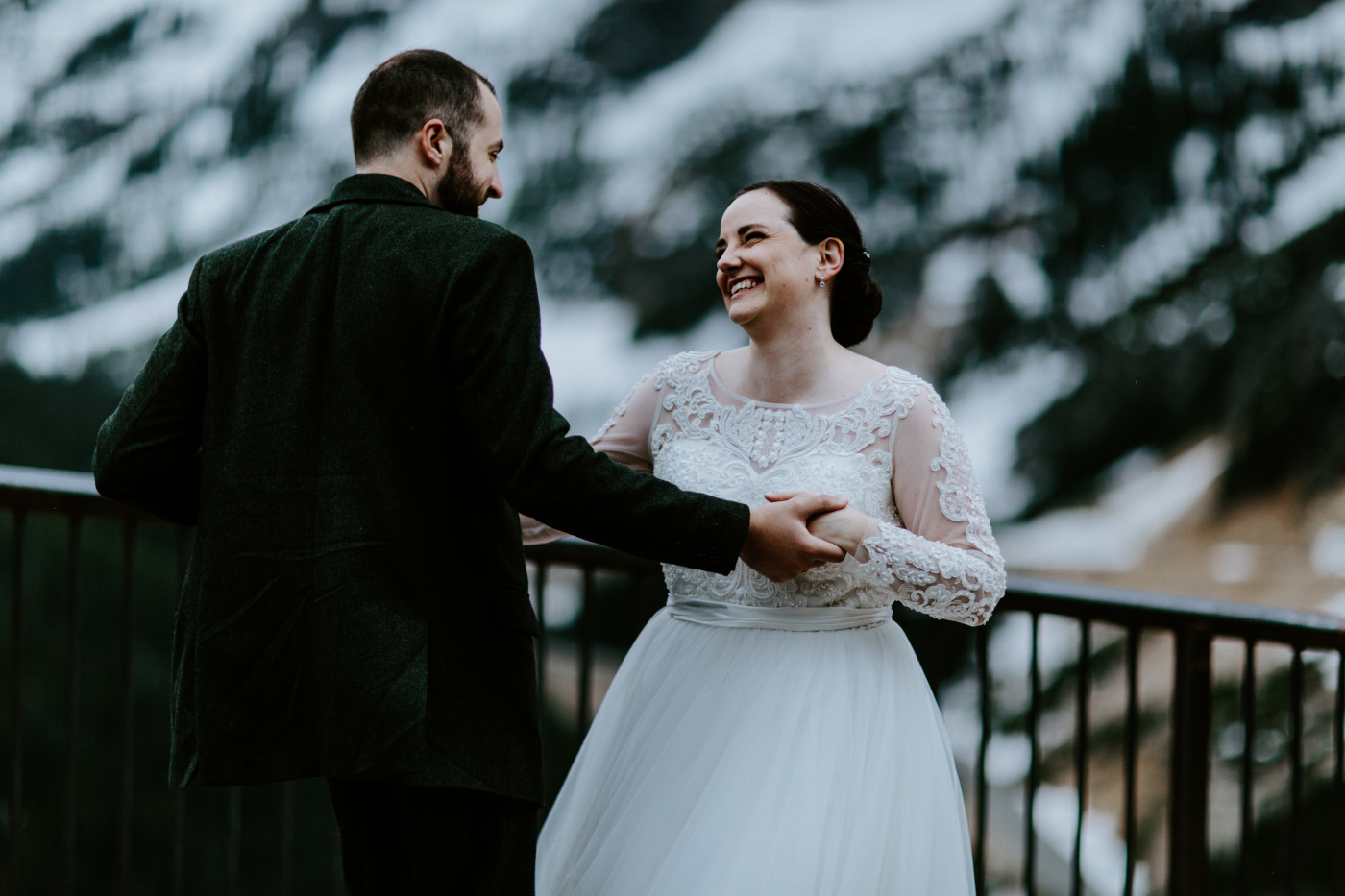 Elizabeth and Alex look out onto the North Cascade Mountains. Elopement photography at North Cascades National Park by Sienna Plus Josh.