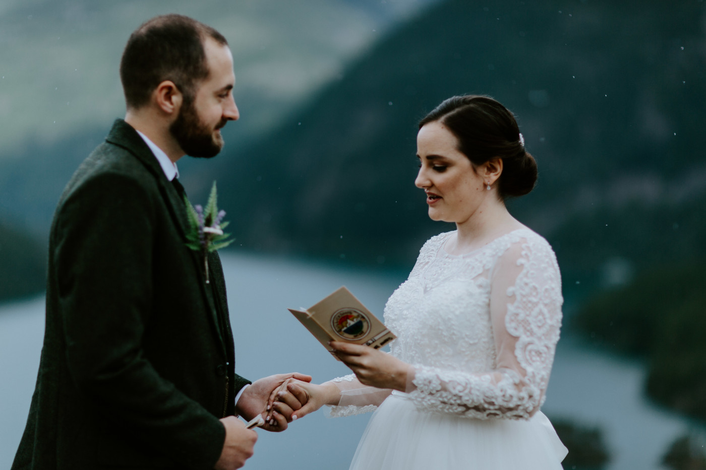 Elizabeth recites her vows at Diablo Lake Overlook. Elopement photography at North Cascades National Park by Sienna Plus Josh.