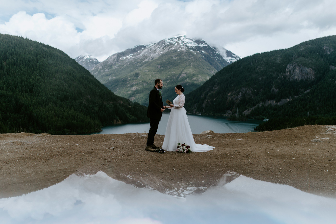 Alex and Elizabeth at Diablo Lake Overlook reciting their vows. Elopement photography at North Cascades National Park by Sienna Plus Josh.
