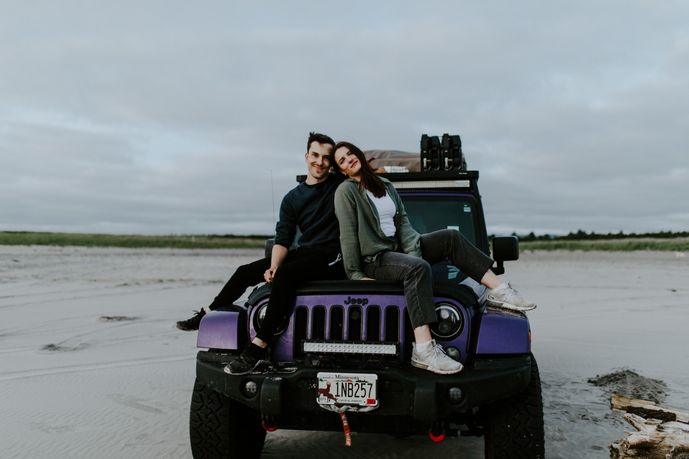 Taylor and Kyle Sit on the Jeep. Elopement photography at North Cascades National Park by Sienna Plus Josh.