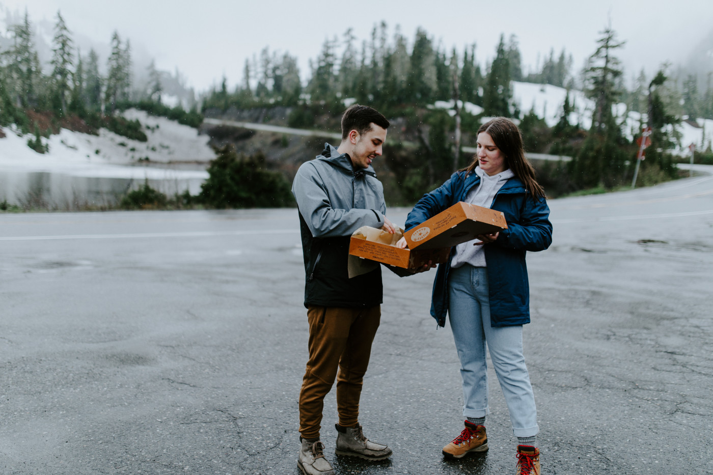 Kyle and Taylor eat donuts after their ceremony. Elopement photography at North Cascades National Park by Sienna Plus Josh.