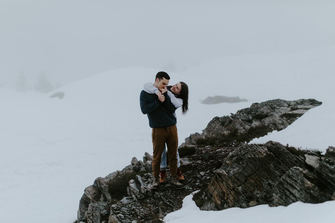 Taylor and Kyle stand on top of a rock. Elopement photography at North Cascades National Park by Sienna Plus Josh.