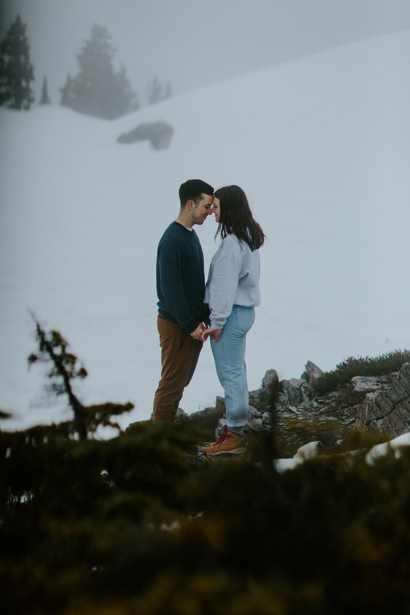 Taylor and Kyle stand forehead to forehead. Elopement photography at North Cascades National Park by Sienna Plus Josh.