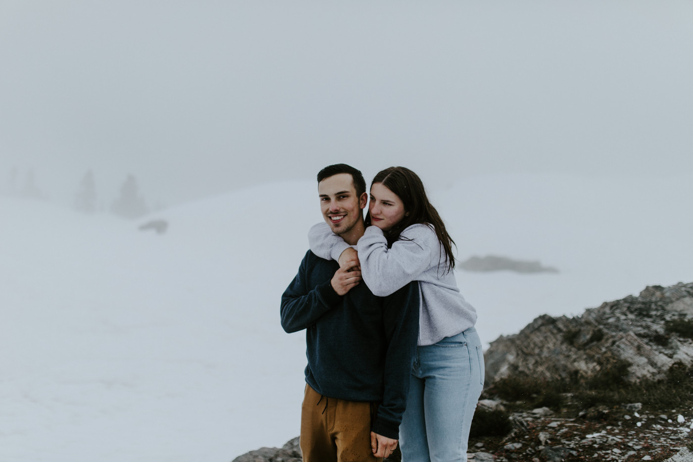 Taylor hangs on Kyle's shoulders. Elopement photography at North Cascades National Park by Sienna Plus Josh.