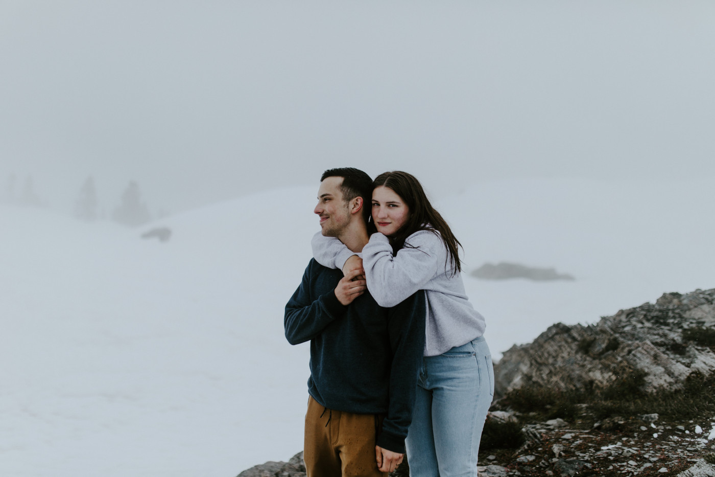 Taylor holds onto Kyle. Elopement photography at North Cascades National Park by Sienna Plus Josh.