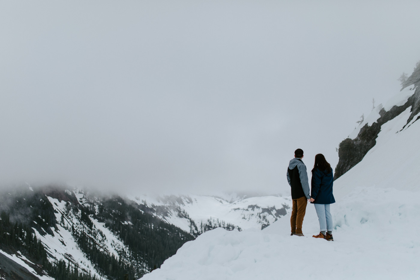 Kyle and Taylor take a look out onto the forest. Elopement photography at North Cascades National Park by Sienna Plus Josh.