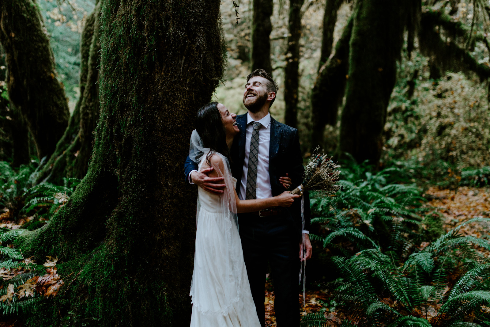 Corey and Mollie stand in the rain. Elopement photography in the Olympic National Park by Sienna Plus Josh.