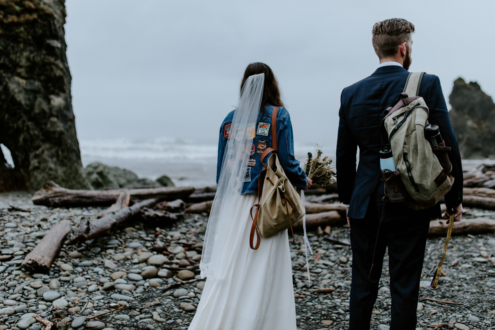 Corey and Mollie stand on the beach. Elopement photography in the Olympic National Park by Sienna Plus Josh.