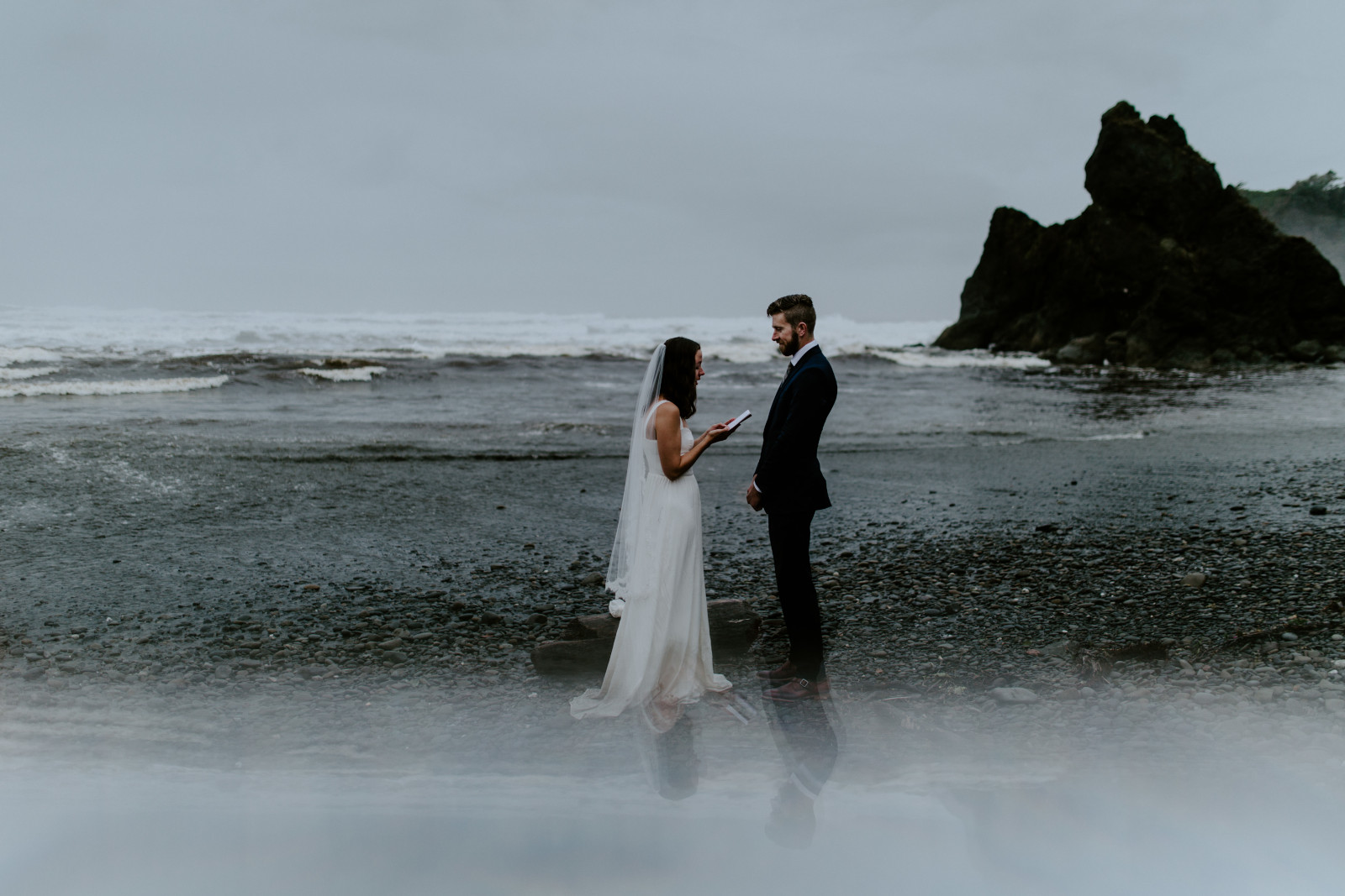 Mollie and Corey stand on the beach as they elope. Elopement photography in the Olympic National Park by Sienna Plus Josh.