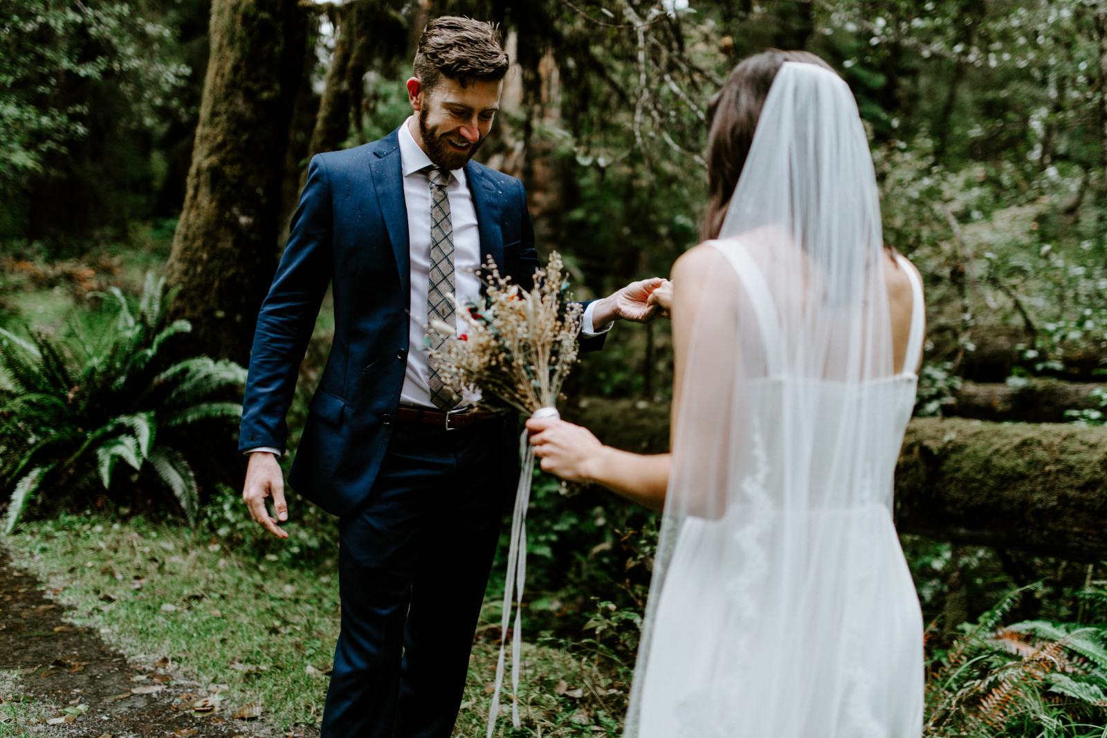 Corey and Mollie check out their outfits. Elopement photography in the Olympic National Park by Sienna Plus Josh.