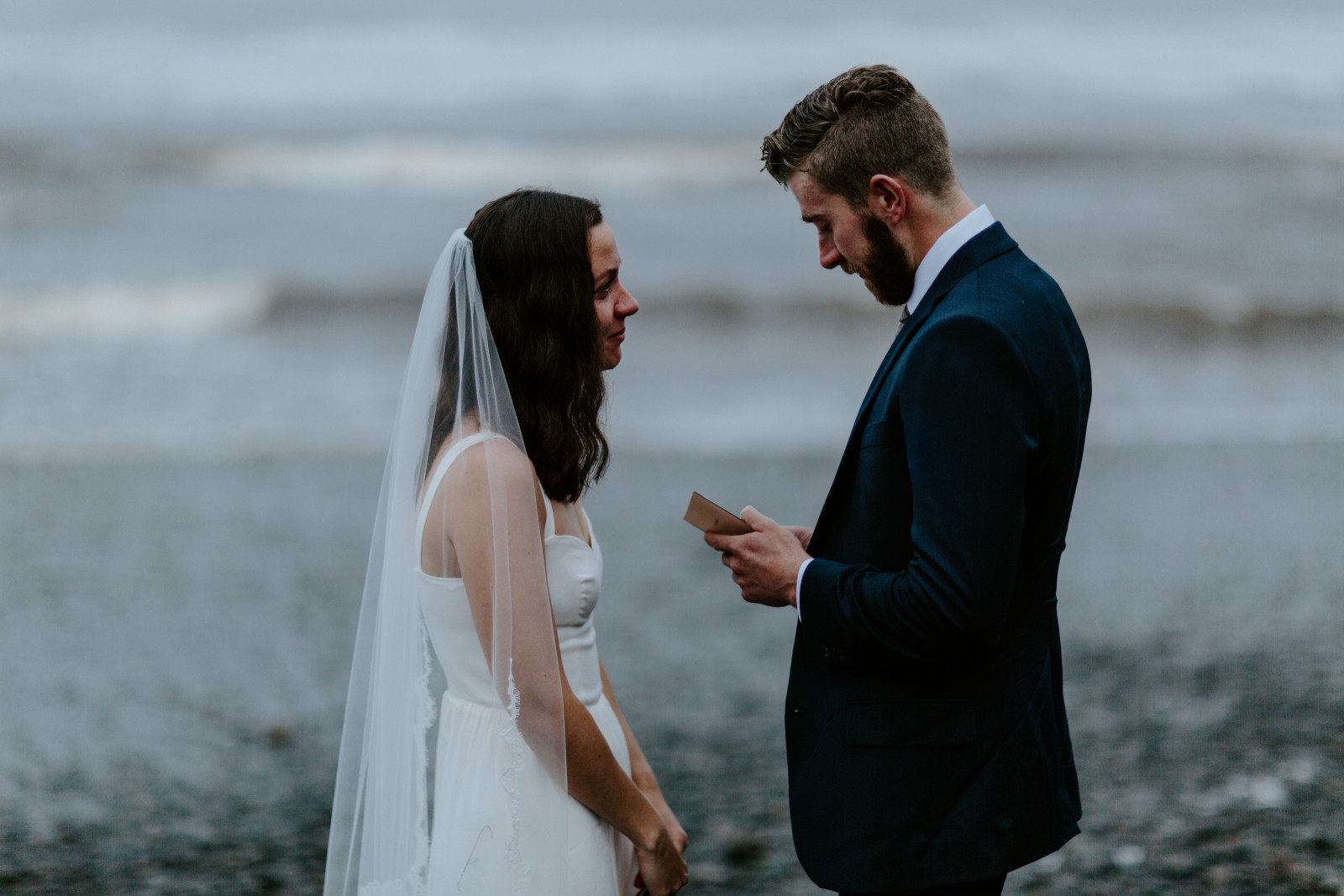 Corey reads his vows to Mollie. Elopement photography in the Olympic National Park by Sienna Plus Josh.