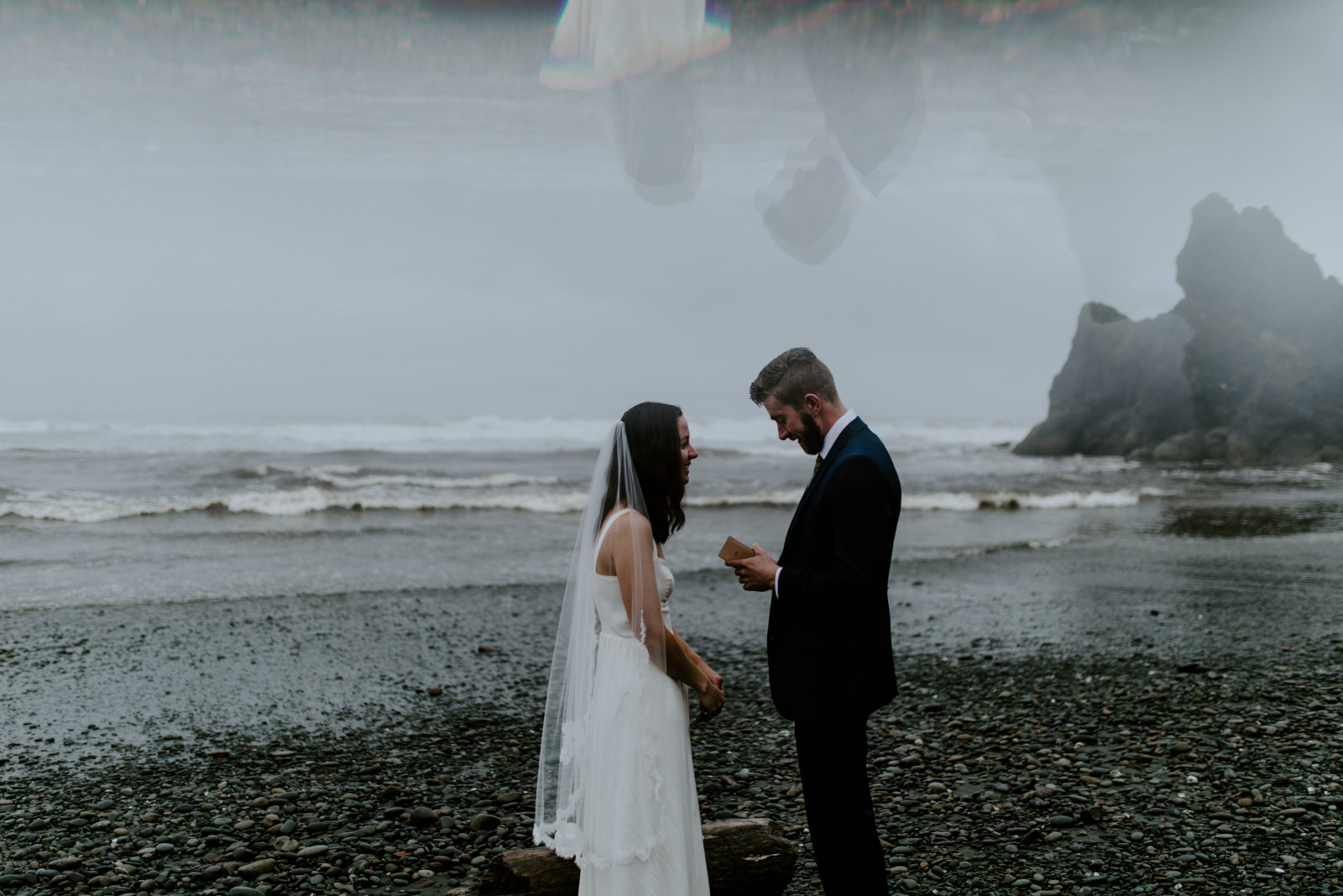Mollie laughs as Corey reads. Elopement photography in the Olympic National Park by Sienna Plus Josh.