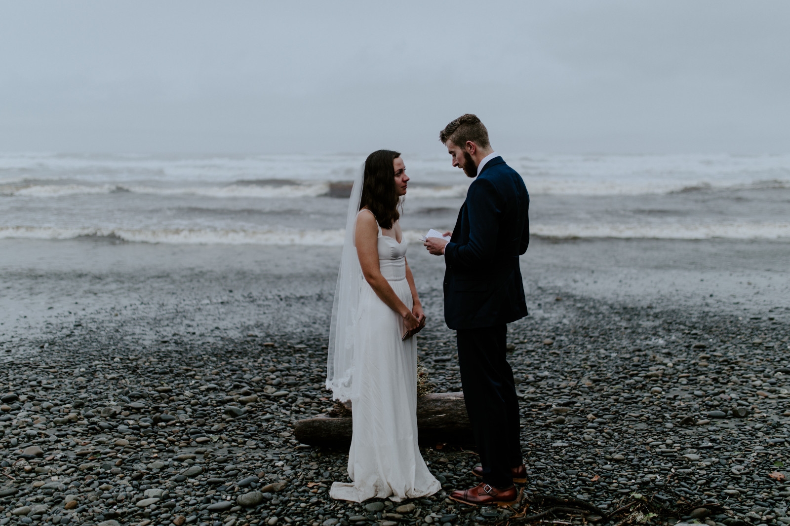 Mollie stands and listens to Corey. Elopement photography in the Olympic National Park by Sienna Plus Josh.