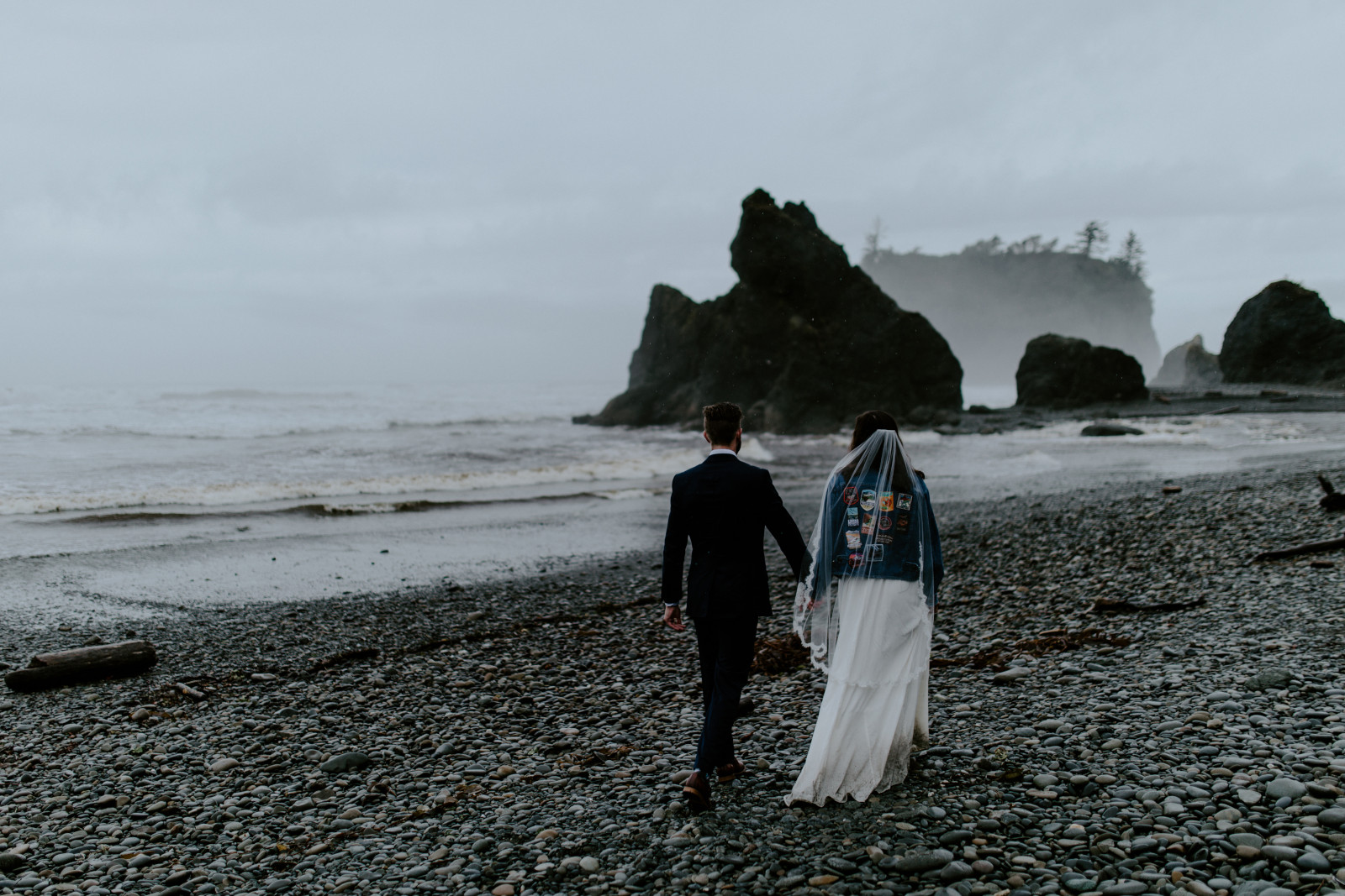 Mollie and Corey walk along the beach. Elopement photography at Olympic National Park by Sienna Plus Josh.