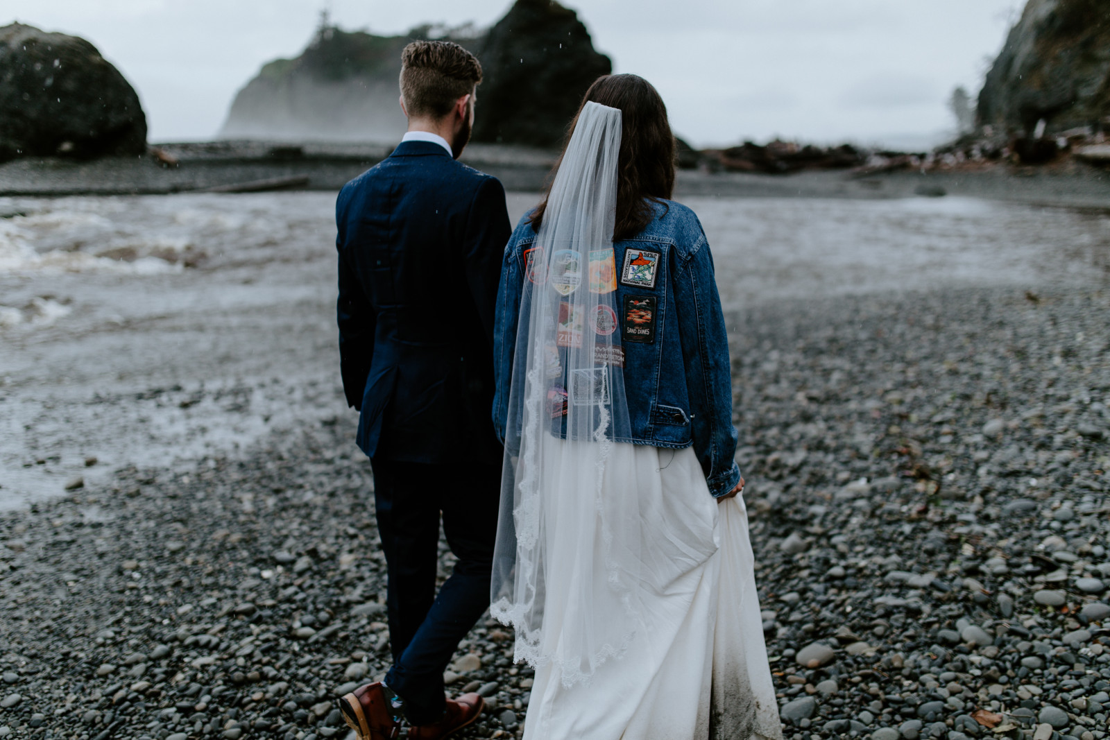 Mollie and Corey walk in the rain. Elopement photography at Olympic National Park by Sienna Plus Josh.