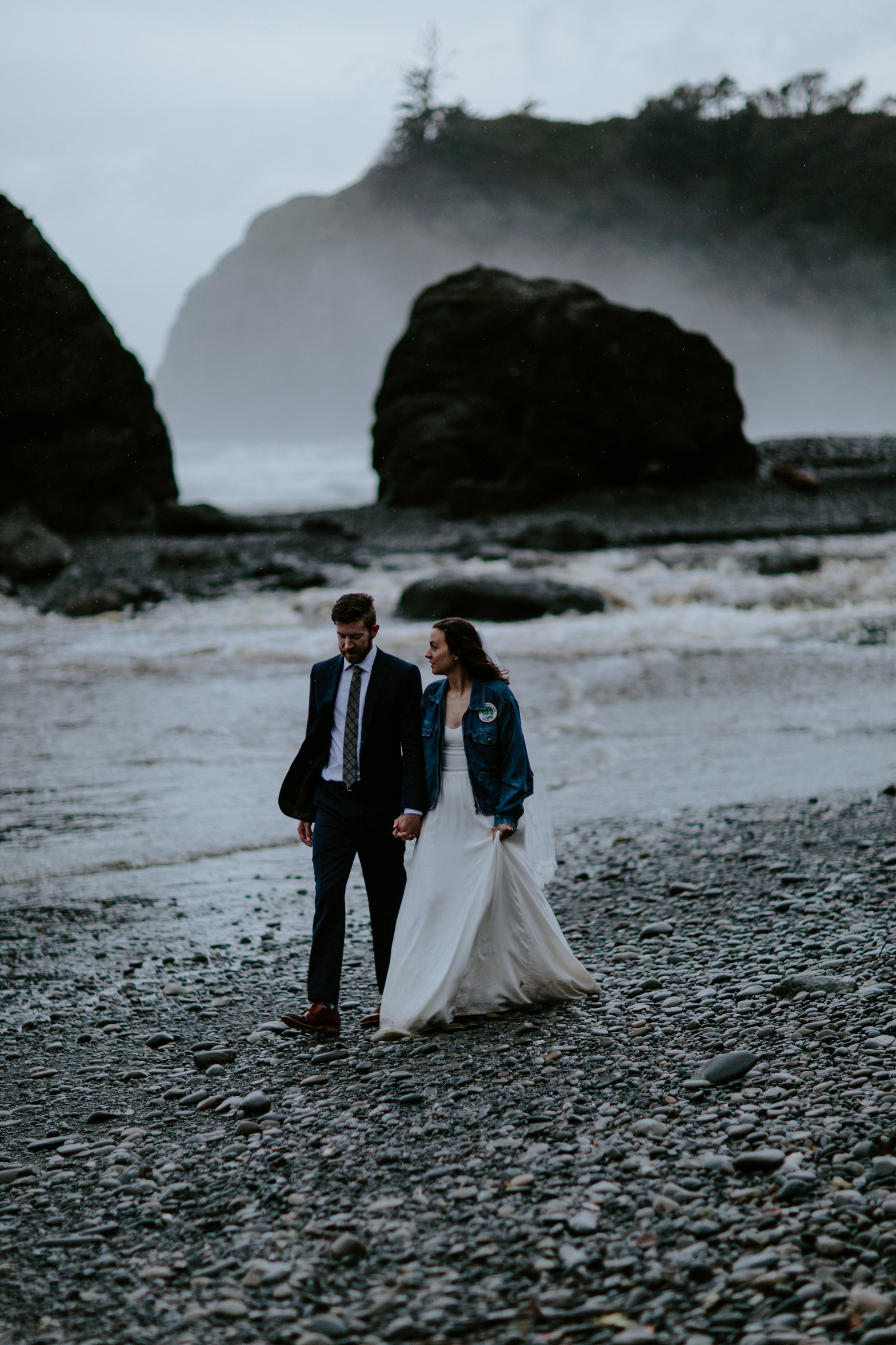 Mollie and Corey walk along the shore. Elopement photography at Olympic National Park by Sienna Plus Josh.