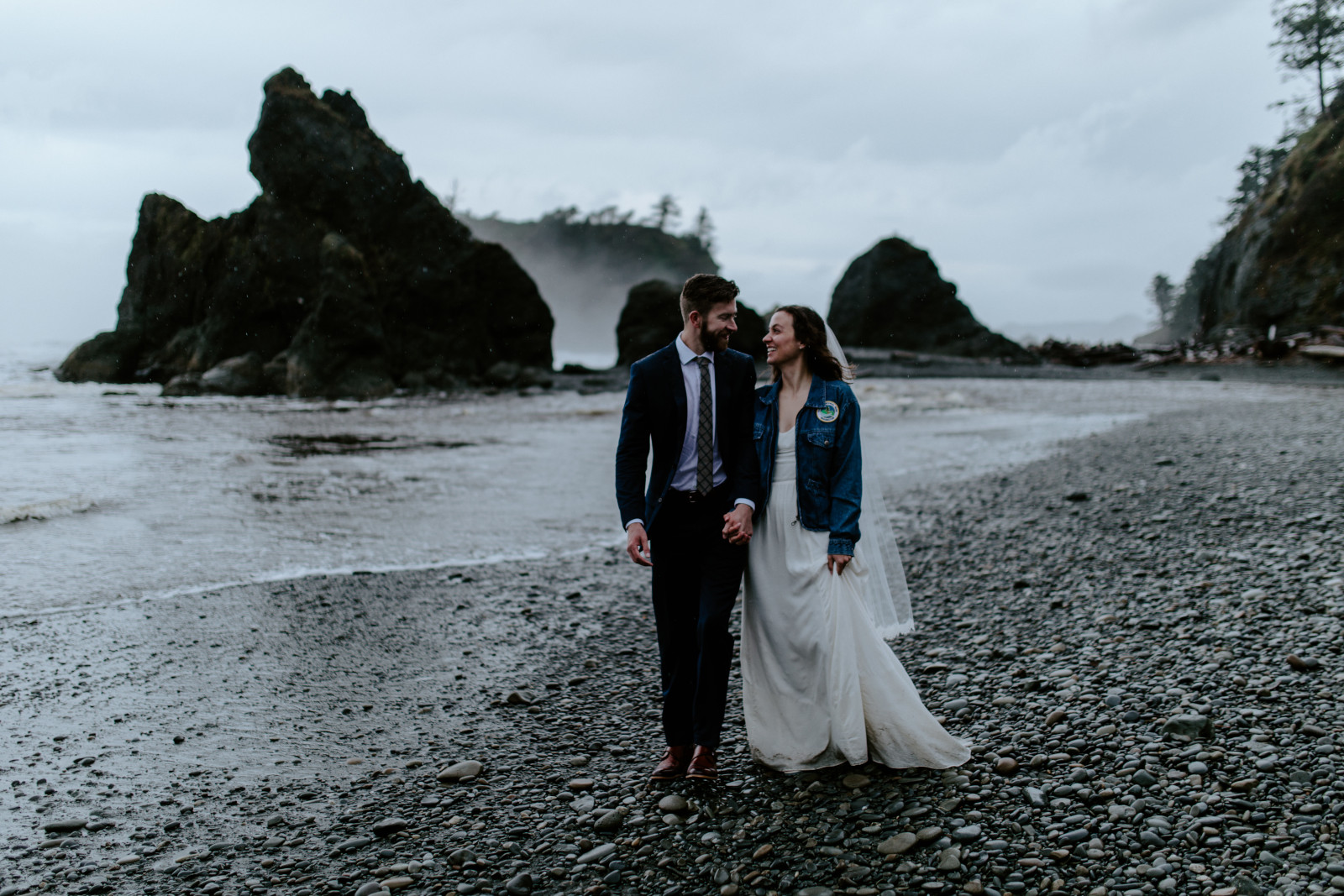 Mollie and Corey look at each other as they walk. Elopement photography at Olympic National Park by Sienna Plus Josh.
