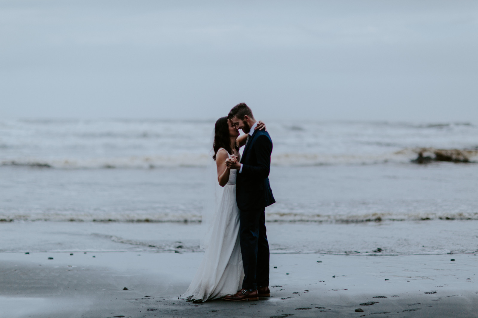 Mollie and Corey dance on the beach. Elopement photography at Olympic National Park by Sienna Plus Josh.
