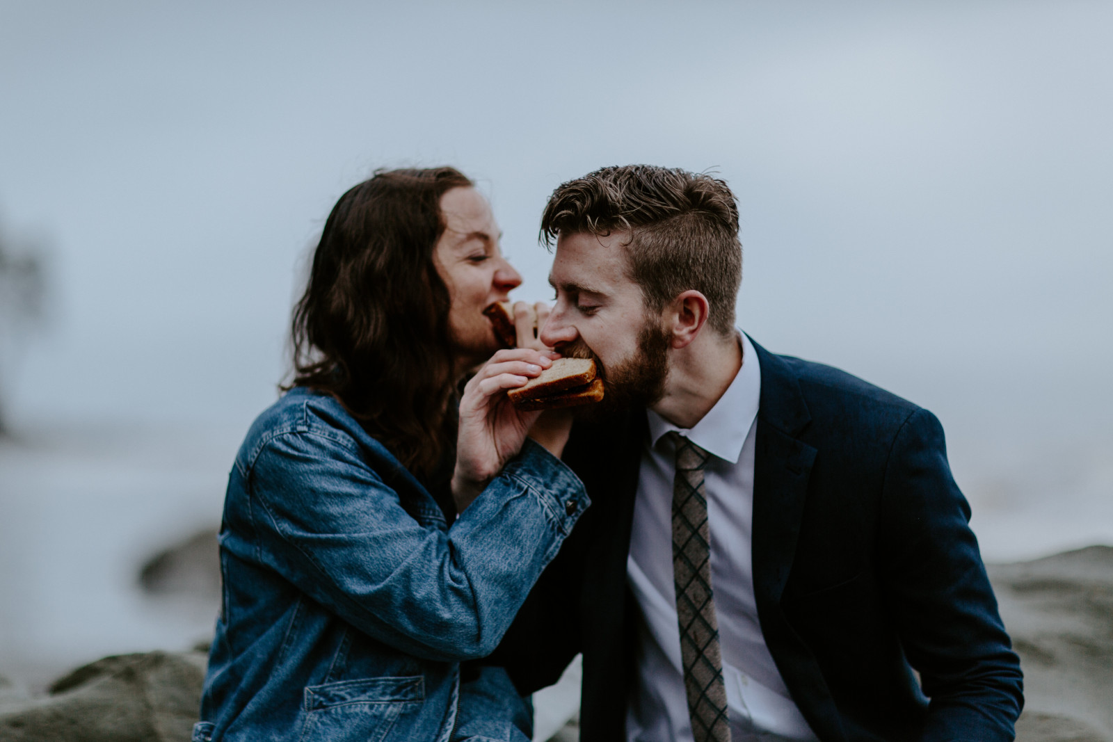 Mollie and Corey share a peanut butter sandwich toast. Elopement photography at Olympic National Park by Sienna Plus Josh.